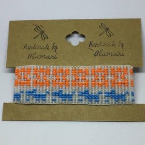 Handmade beaded bracelet "White, orange, blue”